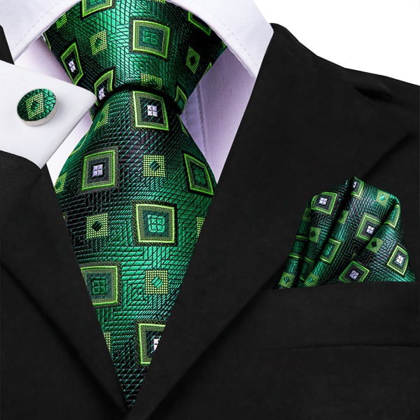 Green mixer square silk tie displayed on a suit