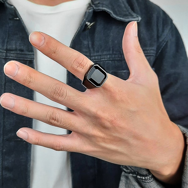 Man wearing a black square signet ring