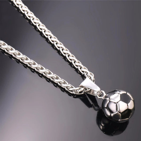 Detailed image of the silver soccer ball pendant and the silver wheat chain necklace
