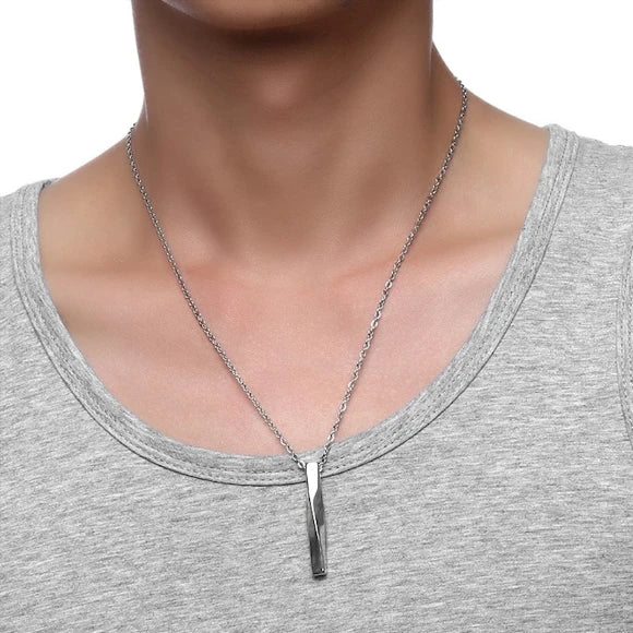 Man wearing a twisted bar pendant necklace