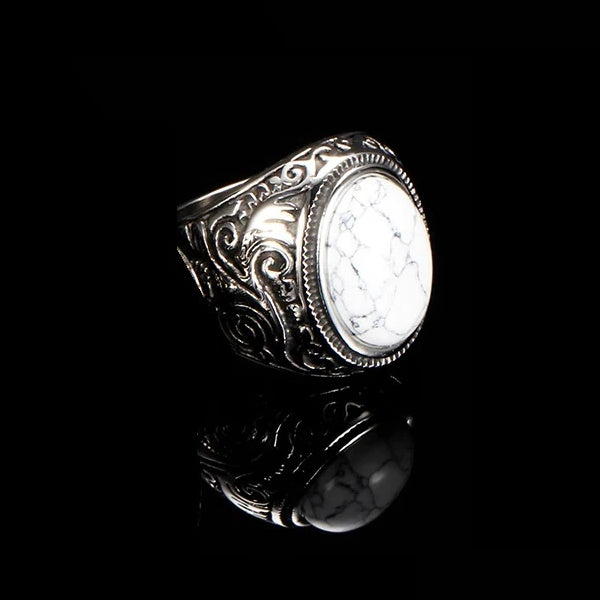 White marble stone ring made of stainless steel on a black background