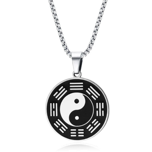 Yin yang pendant necklace hanging on a silver box chain