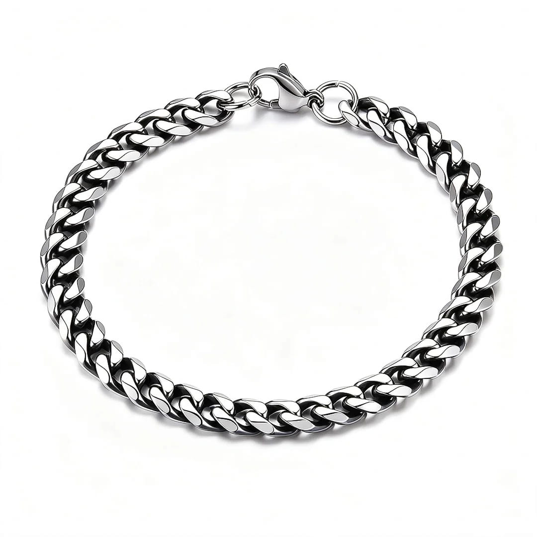A 7mm oxidized silver-toned stainless steel Cuban link chain bracelet with a polished finish, shown on a clean white background.