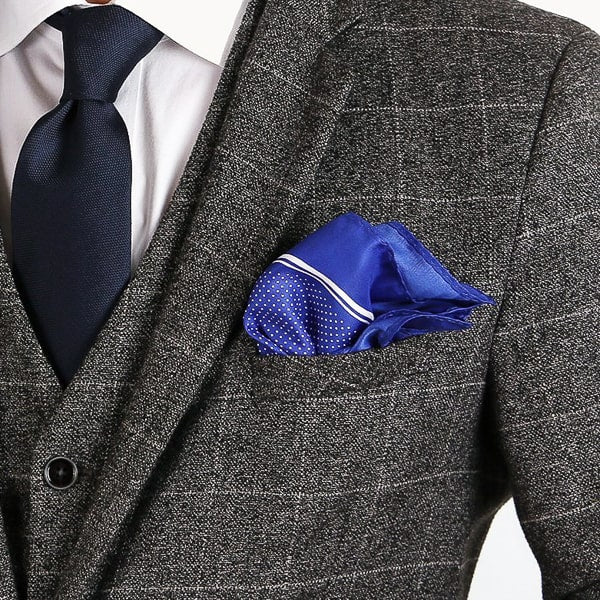 Blue micro dot pocket square in suit pocket