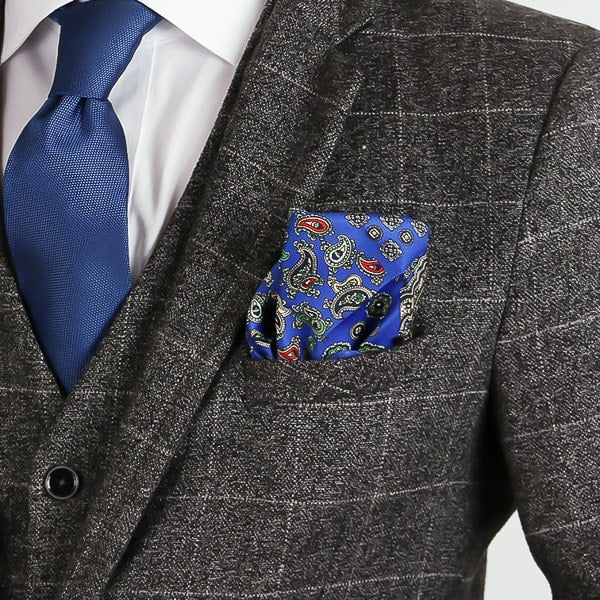 Blue multi-pattern paisley pocket square in suit jacket pocket