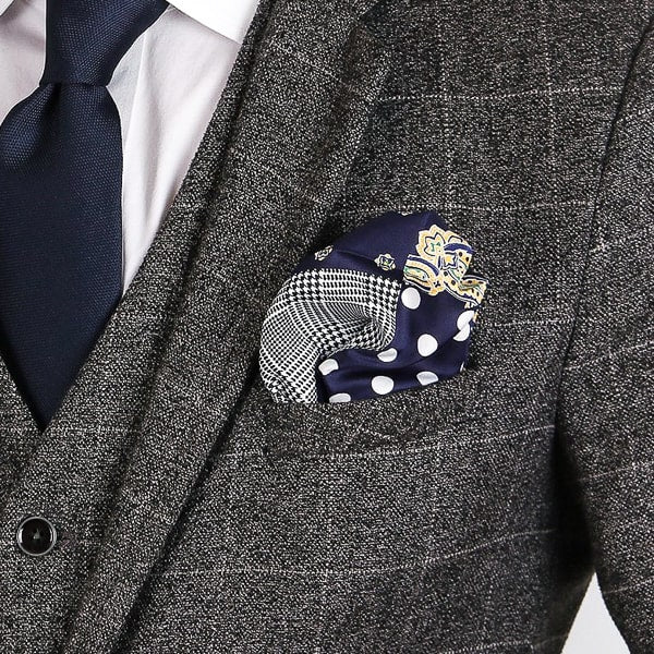 Blue multi-pattern pocket square in suit pocket