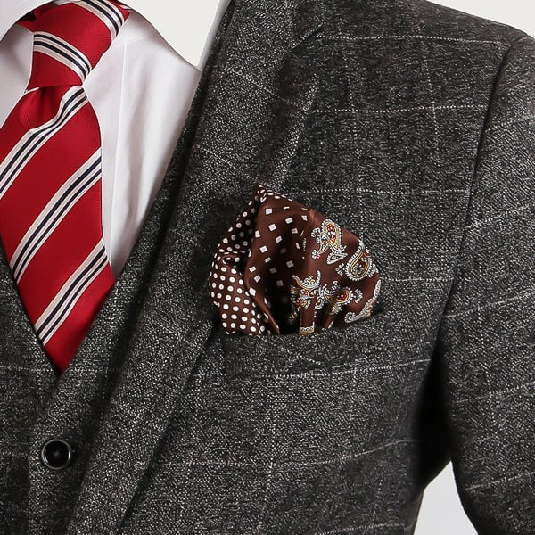 Brown multi-pattern pocket square in suit jacket pocket