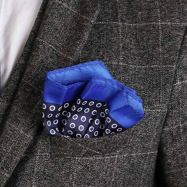 Dark blue dotted pocket square in suit jacket pocket