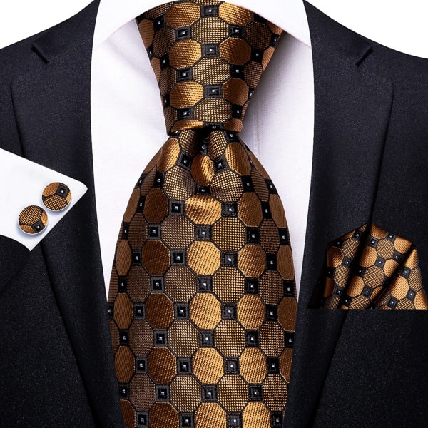Gold black octagon silk tie displayed on a suit