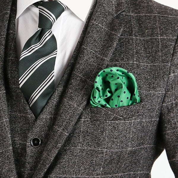 Green and navy blue dotted pocket square in suit pocket