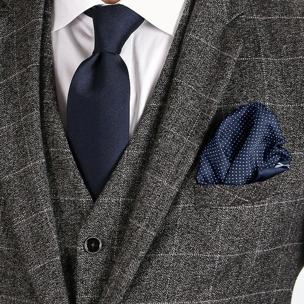 Navy blue micro dot pocket square in suit pocket
