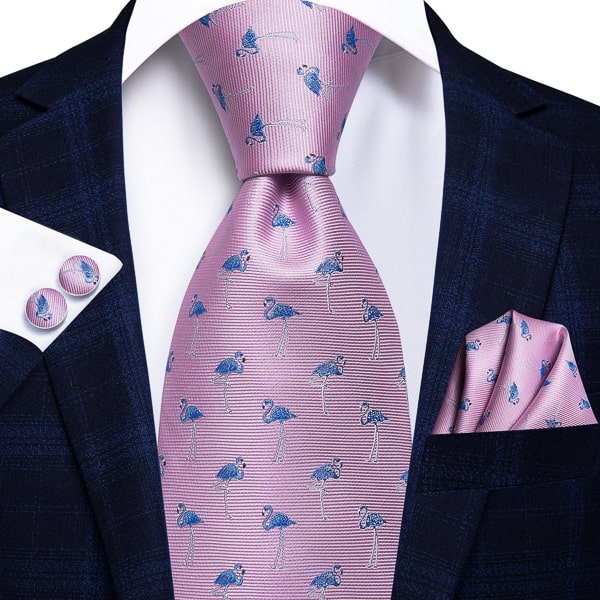 Pink flamingo novelty silk tie displayed on a suit