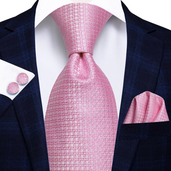 Pink plaid luxury silk tie displayed on a suit