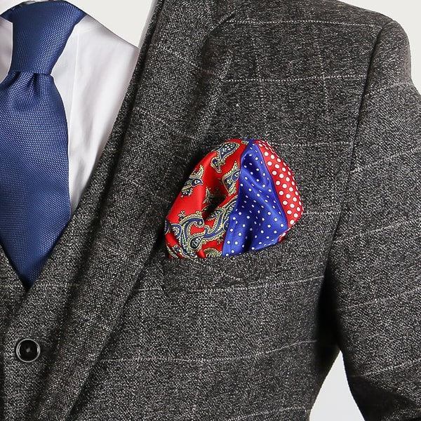 Red and blue multi-pattern pocket square in suit jacket pocket