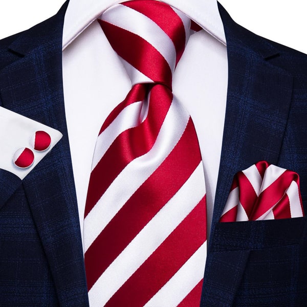 Red white candy striped silk tie displayed on a suit
