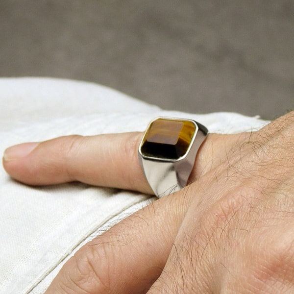 Man wearing a square tiger eye ring
