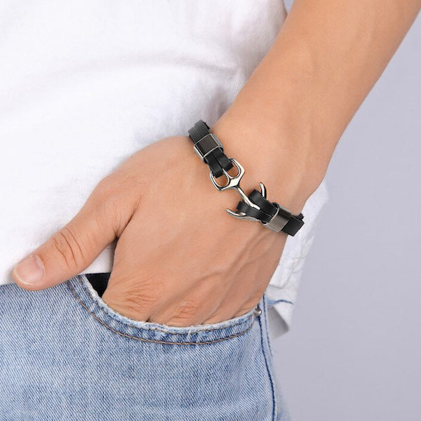 Man wearing a black and silver leather anchor bracelet