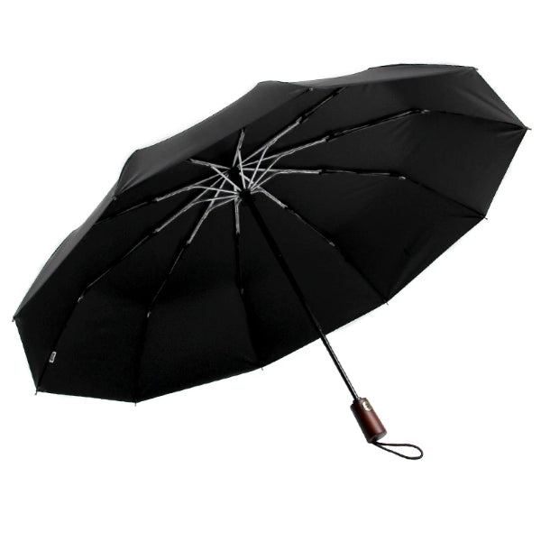 Open black umbrella with a wooden handle and a wrist strap