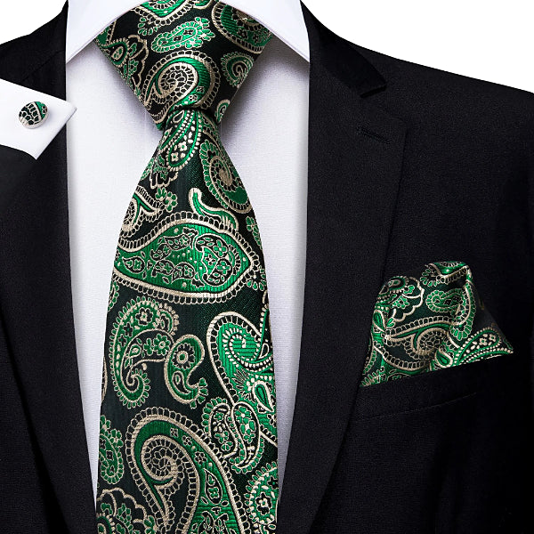 Green & black silk paisley tie set displayed on a suit
