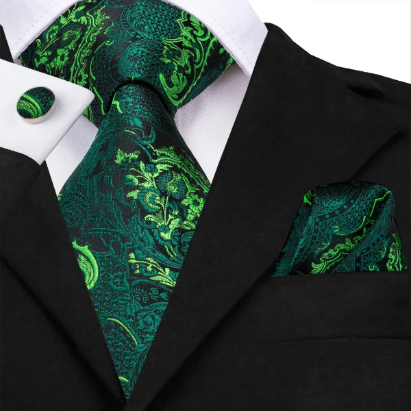A luxurious green silk floral necktie set on a suit