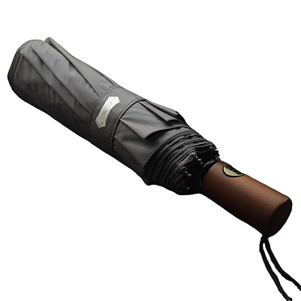 Grey travel umbrella with a wooden handle
