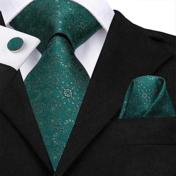 Jade green floral silk tie set on a suit