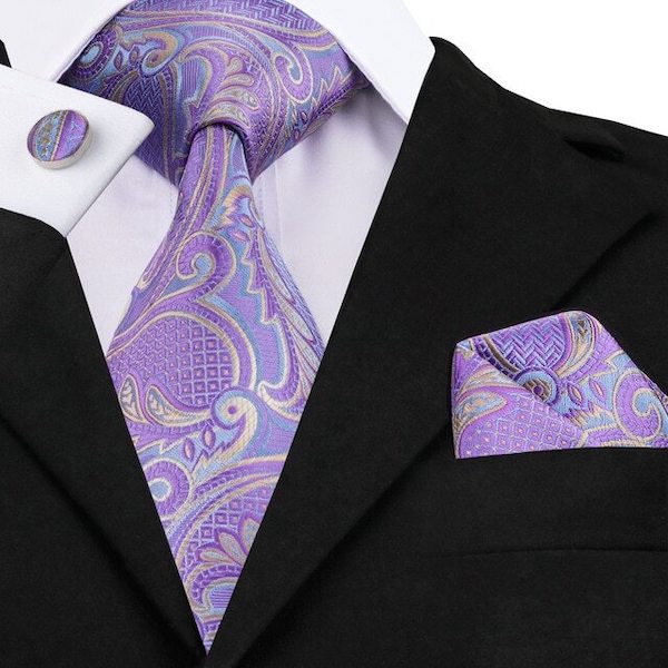 Man wearing a pastel lilac paisley silk necktie set with matching pocket square and cufflinks
