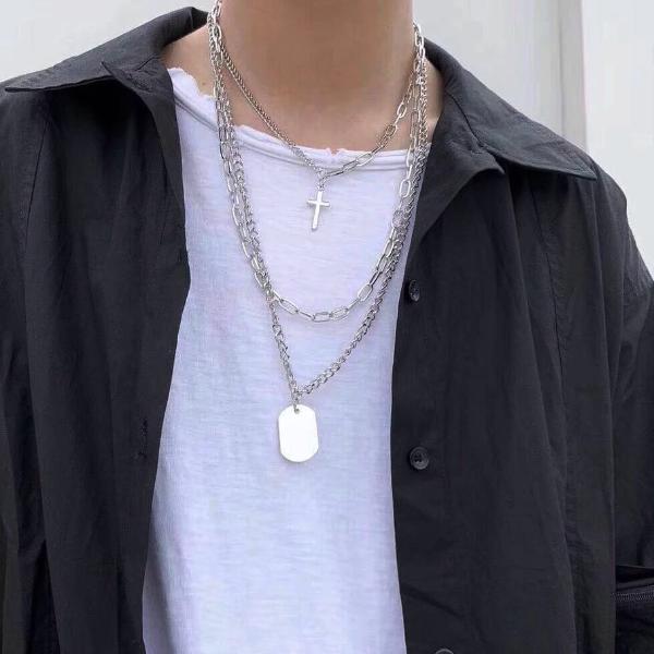 Man wearing a layered necklace