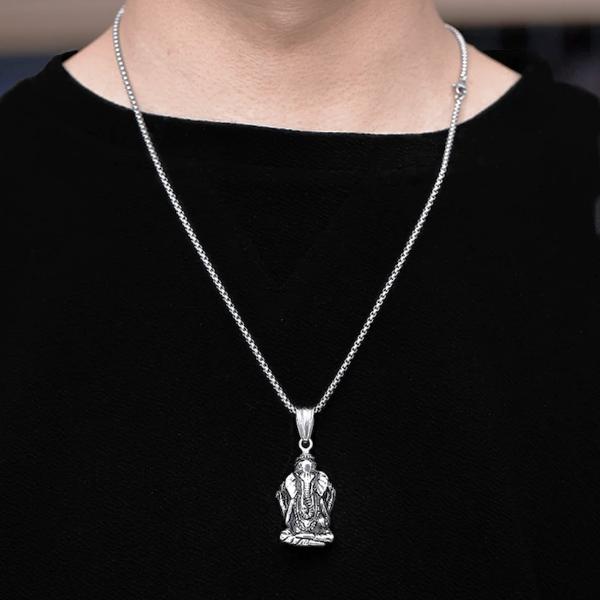 Man wearing a silver Ganesh pendant necklace