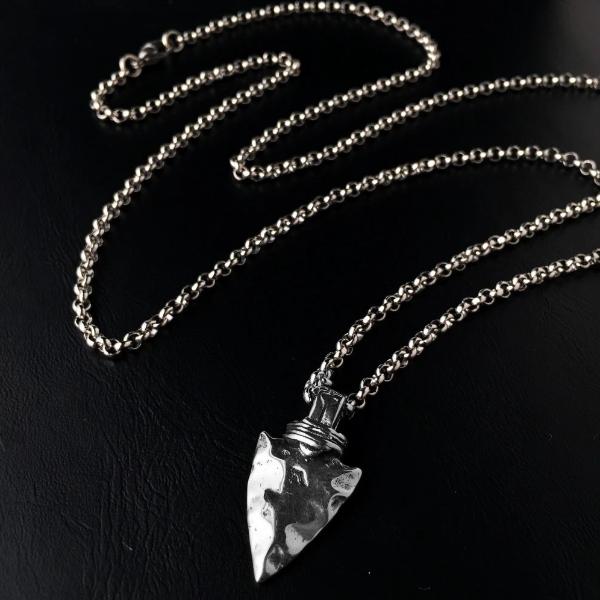 Silver spearhead pendant necklace in a detail image