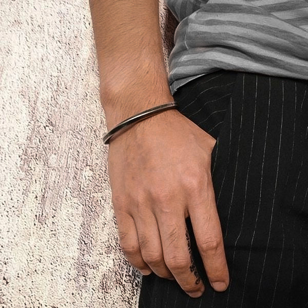 Twisted vintage cuff bracelet on a man's wrist