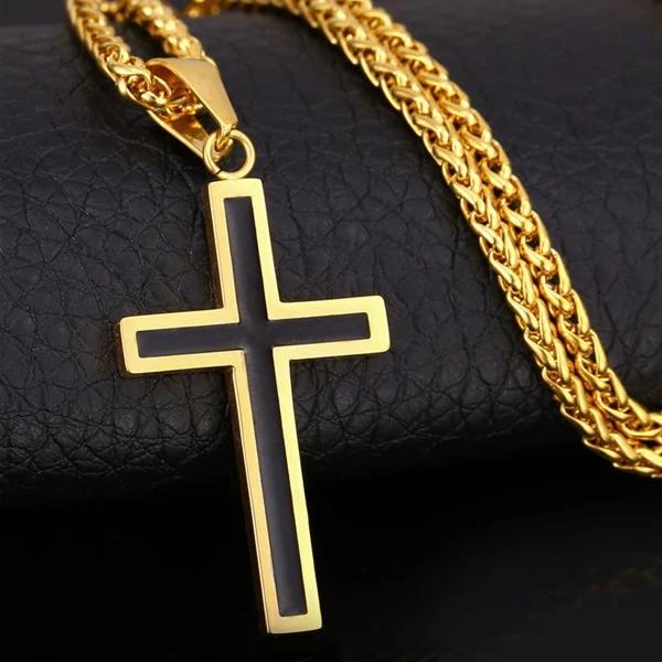 black and gold cross pendant and chain close up