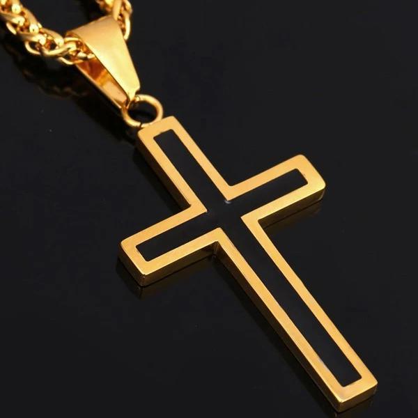 close details of the black and gold cross pendant