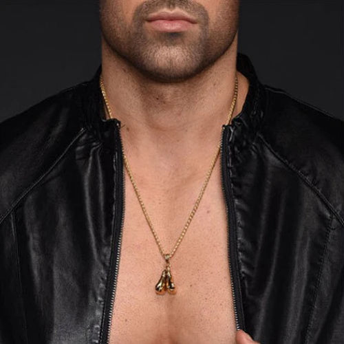 Man Wearing A Gold Boxing Gloves Pendant Necklace