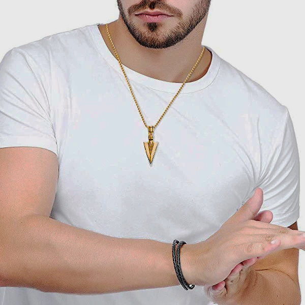 Man Wearing A Gold Arrowhead Pendant Necklace
