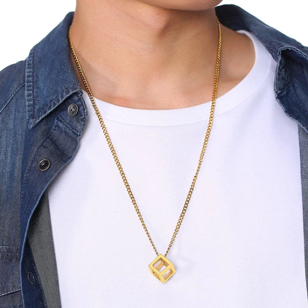 Man wearing a gold cube pendant necklace for men