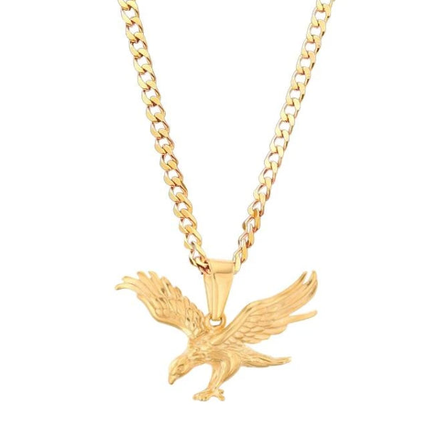 gold eagle pendant hanging from a golden curb chain necklace