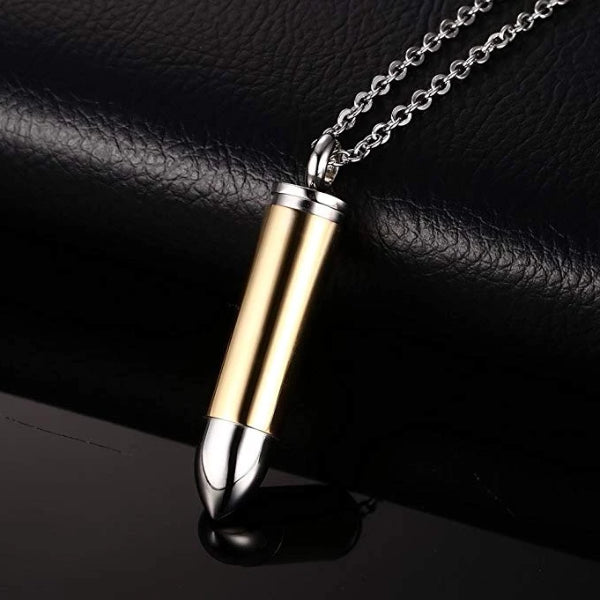 Details of the gold and silver bullet pendant necklace