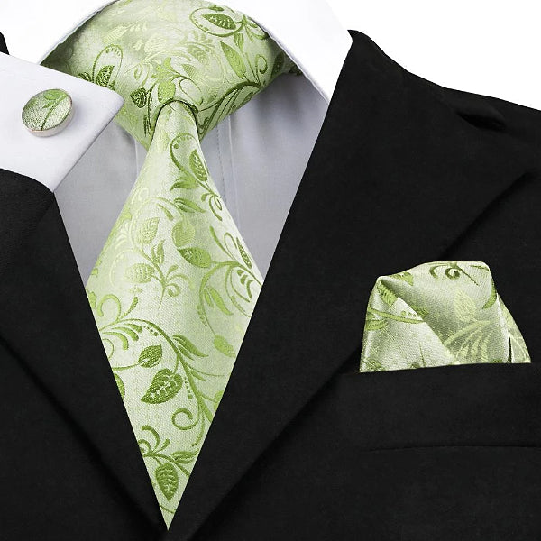 Green rose leaves silk tie set displayed on a suit