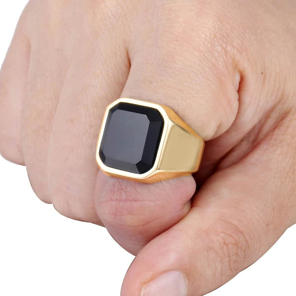 Gold ring with square shaped black zirconia on finger