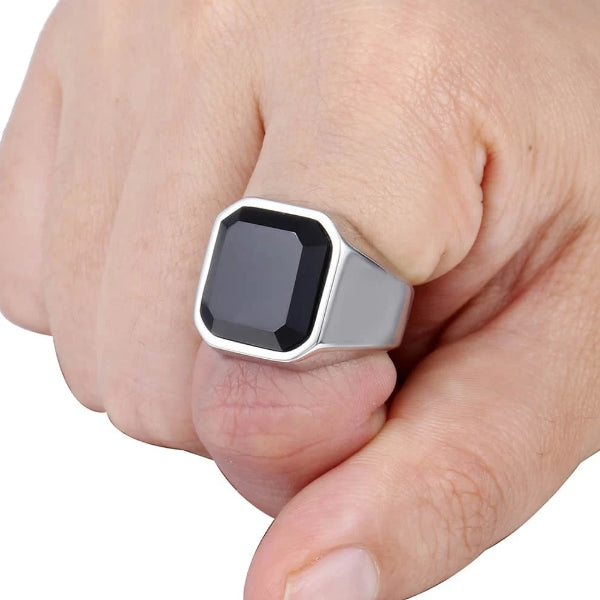 Silver ring with square shaped black zirconia on finger
