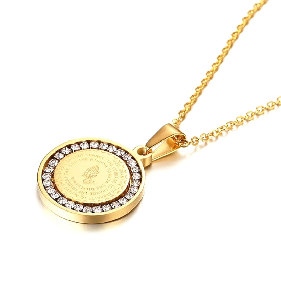 The gold round pendant has a CZ halo around the serenity prayer and an image of praying hands
