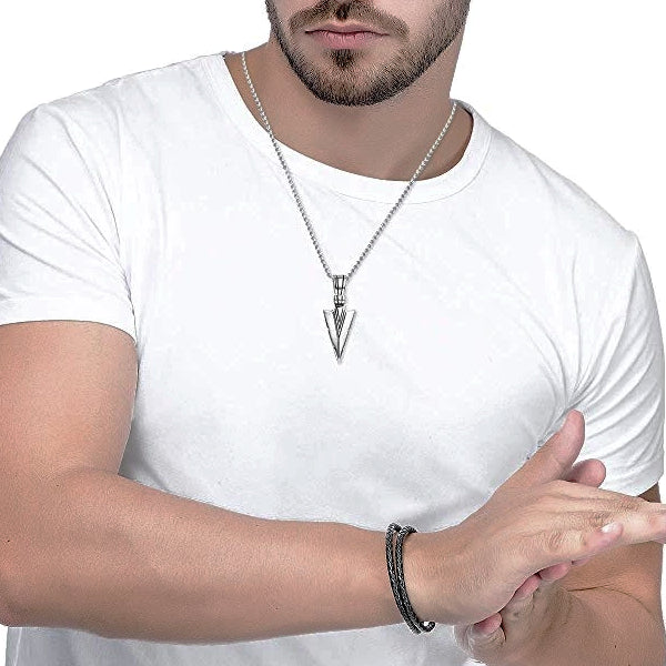 Man wearing a silver arrowhead pendant necklace