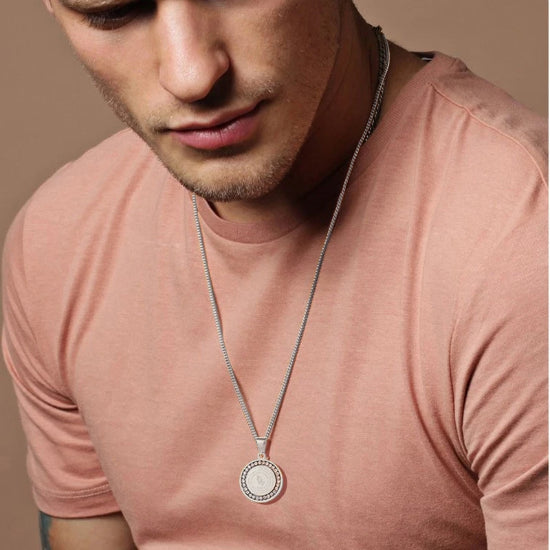 Man wearing a silver serenity prayer necklace