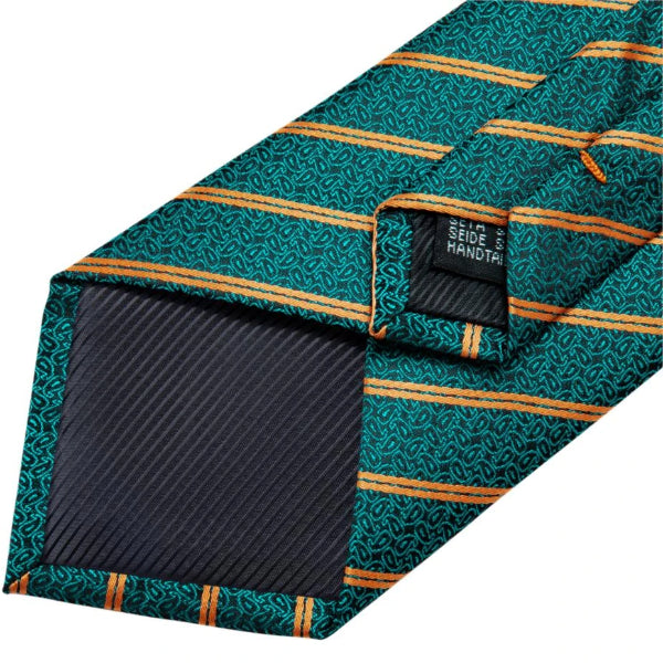 Details of the backside of the teal green & gold striped paisley tie
