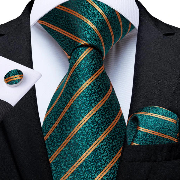 Teal green necktie set with pocket square and cufflinks on a suit