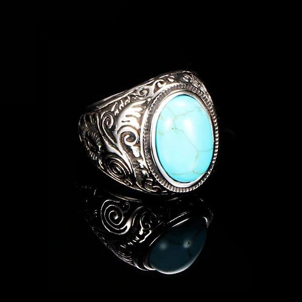 Turquoise stone ring made of stainless steel on a black background
