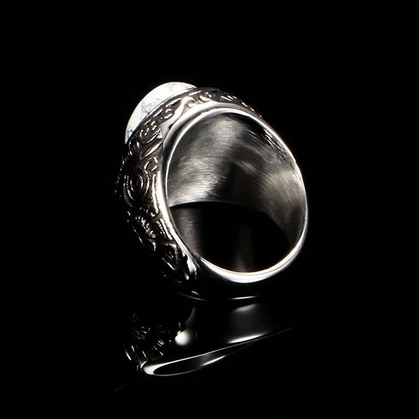 Details of the inside of the marble ring showing the brushed steel