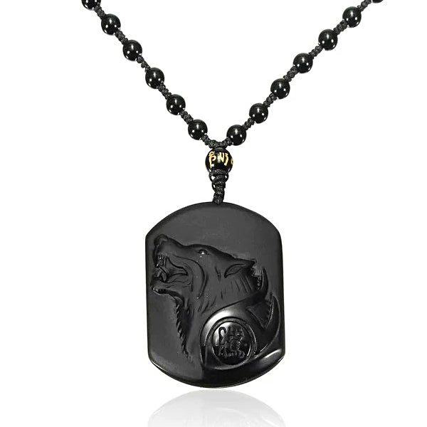 Black wolf charm pendant hanging on a beaded chain necklace